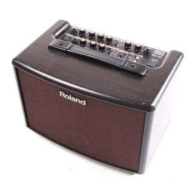 【中古】 アコギアンプ ローランド ROLAND AC-33-RW アコースティックギター用アンプ アコギアンプ ローズウッド調 斜めアングル画像